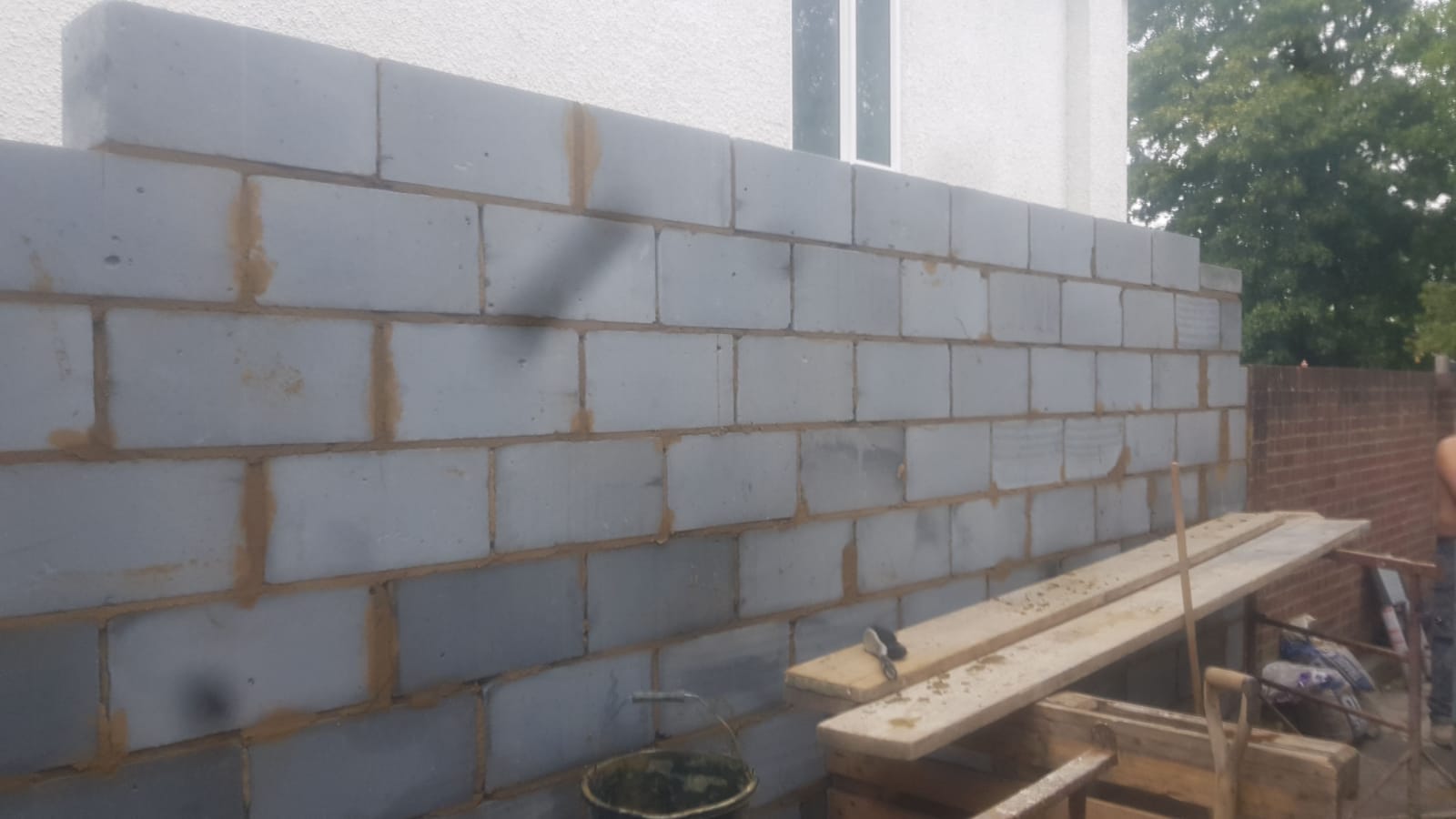 Brick and blockwork built from foundations to roof plate